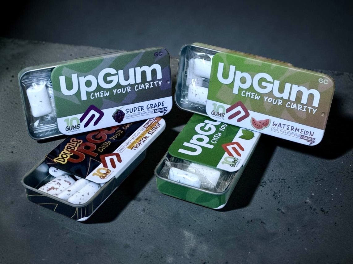 Four open UpGum tins, one of each flavour