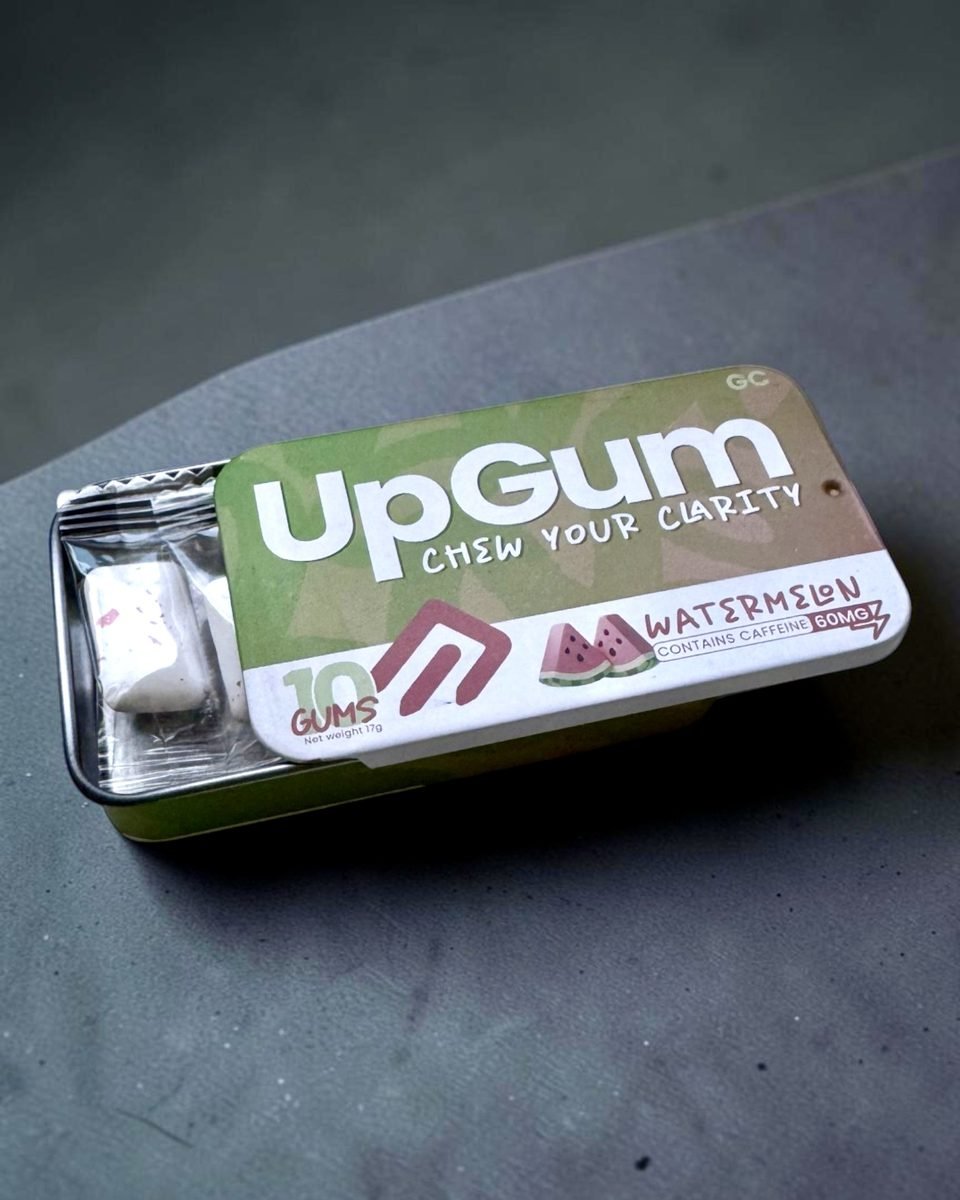 An open tin of Watermelon UpGum showing the gum inside